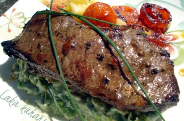 Strip steak with roasted cherry tomatoes and vegetable mash